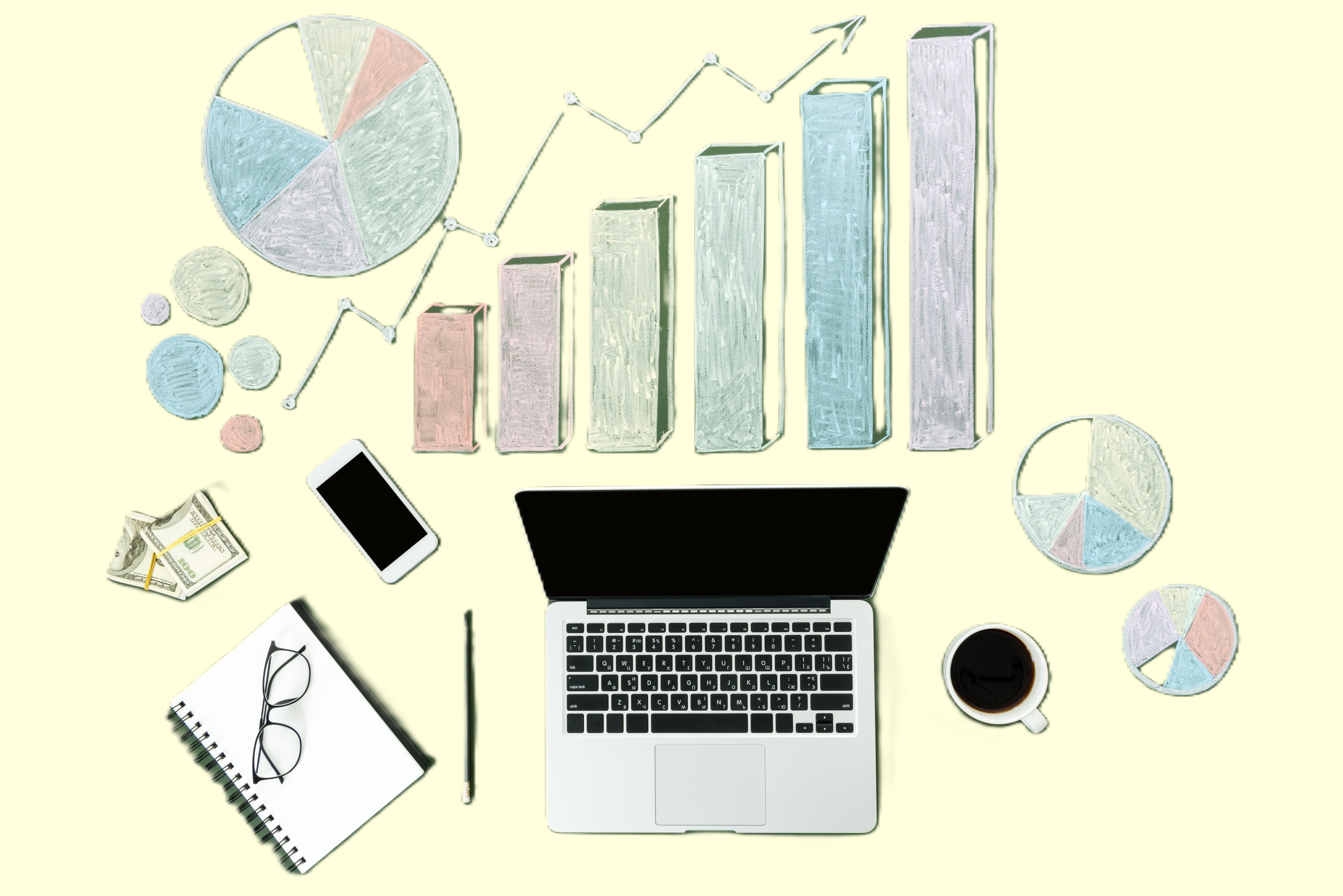 top-view-of-laptop-and-business-charts-